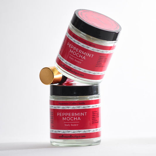 Two jars of peppermint mocha body butter on a white background with peppermint mocha diffuser blend