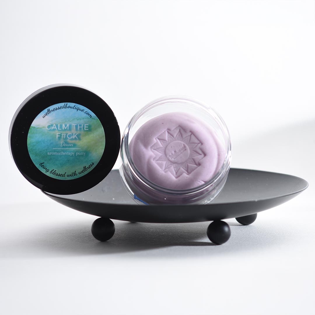 Calm Down Stress Relief Putty with a black lid featuring text on a white background