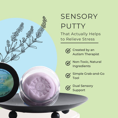 A jar of calm down sensory putty sits on a dark tray against a pale green background with text describing its stress-relief benefits. Part of the product container is visible on the left, and the open jar shows a lavender-colored putty with an embossed sunburst pattern.