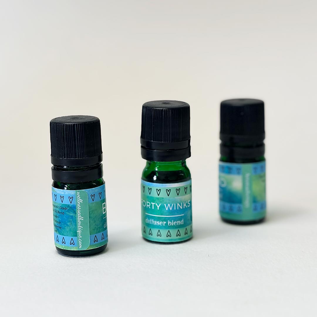 Three bottles of Forty Winks diffuser blend for sleeping well on a white background