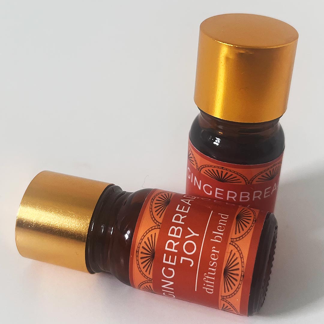 Two bottles of 'Gingerbread Joy' diffuser blend on a white background