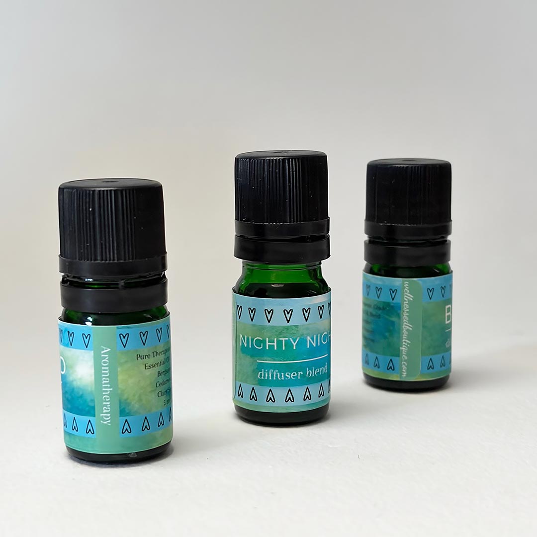 Three bottles of Nighty Night sleep diffuser blends with blue labels on a white background