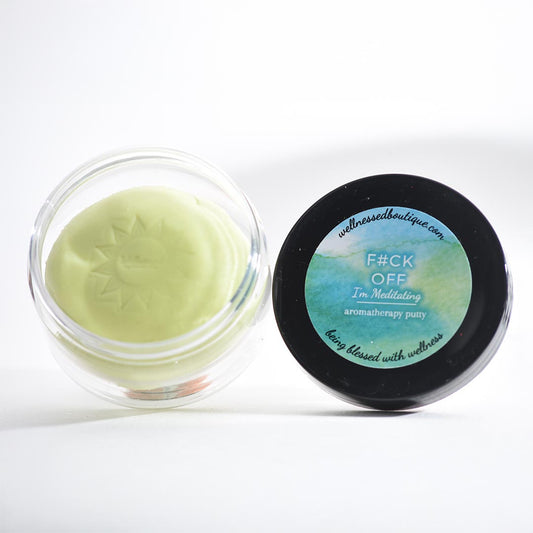 A container of I'm Meditating Sensory Putty with a black lid featuring text on a white background