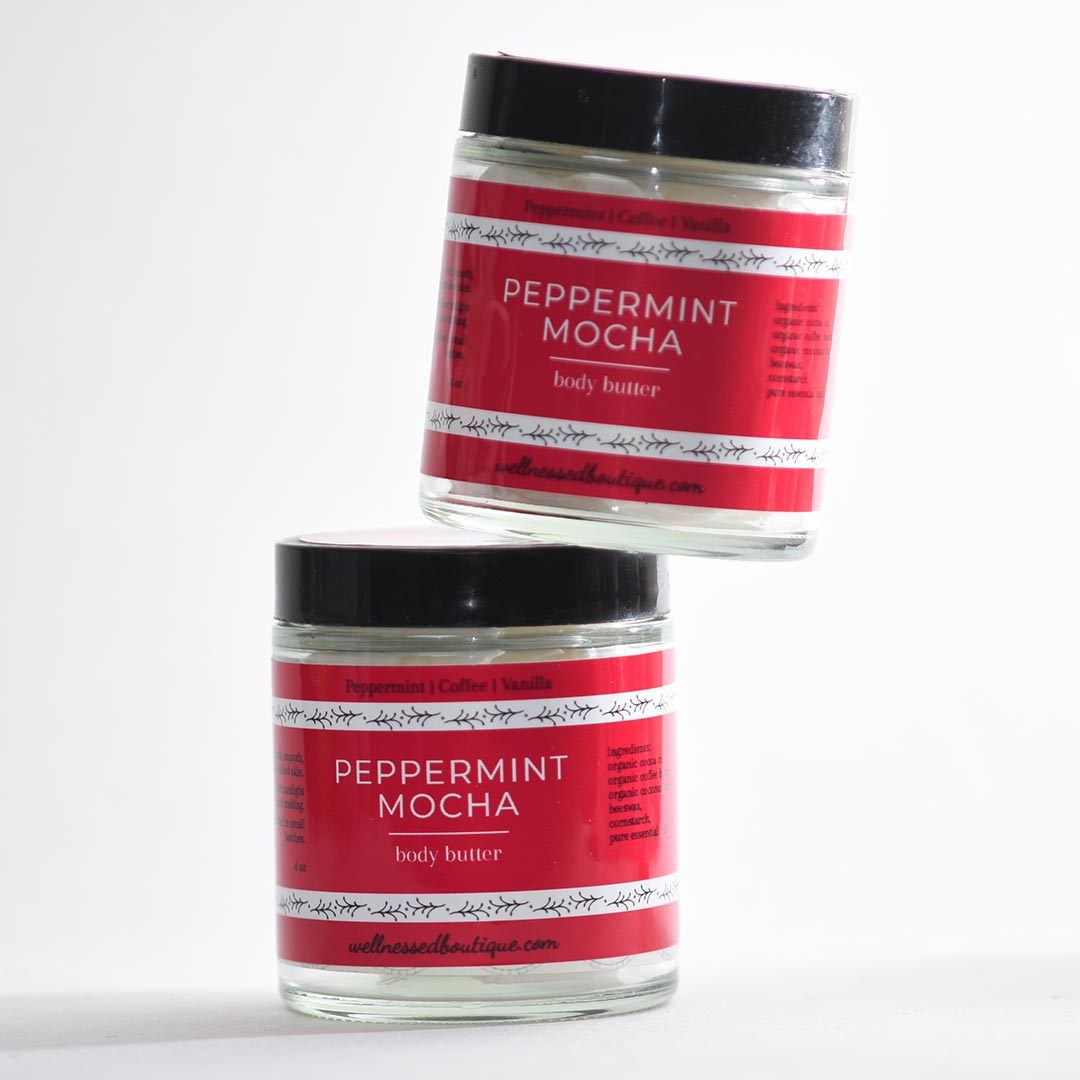 Two jars of peppermint mocha body butter on a white background