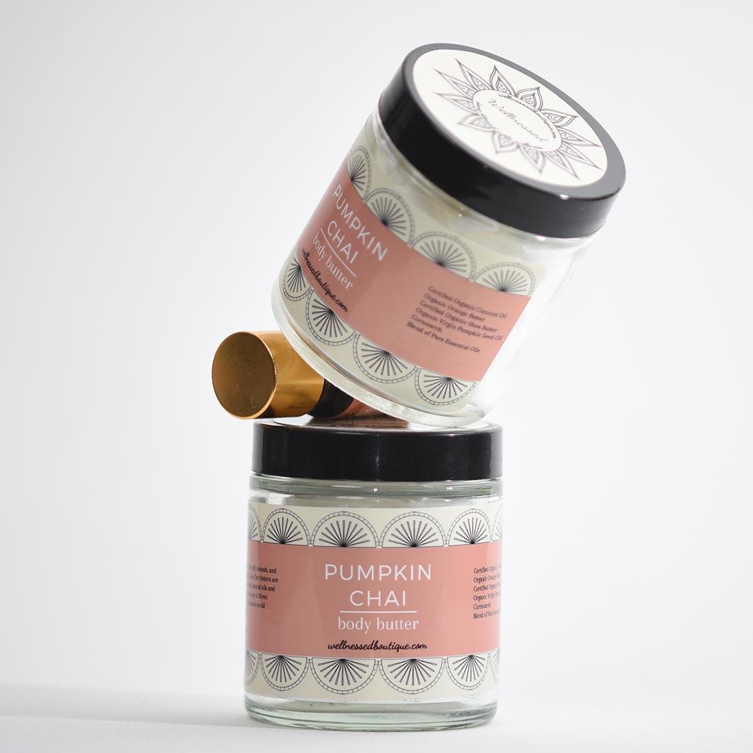 Two jars of pumpkin chai body butter on a white background