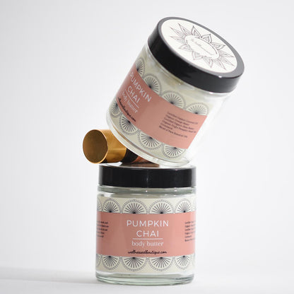 Two jars of pumpkin chai body butter on a white background