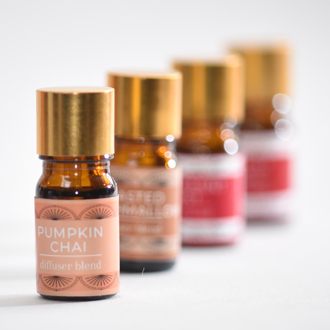 Bottle of 'Pumpkin Chai' diffuser blend with gold cap on a white background