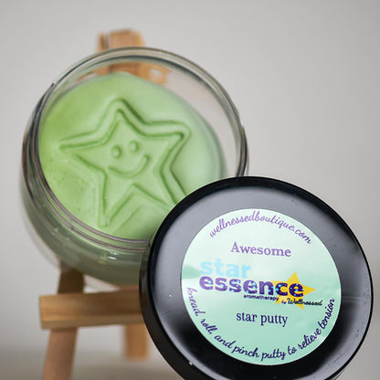 Green star-shaped Awesome Aromatherapy toy putty in a glass jar with a label on a white background