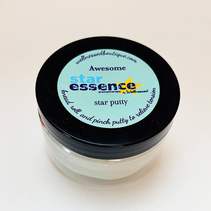 Jar of star essence awesome sensory aroma putty with a black lid on a light beige background