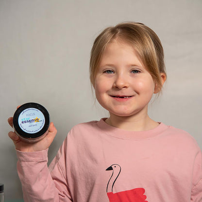 Young girl holding Star Essence Focus Aromatherapy Play Putty