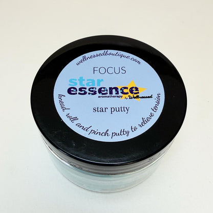 Jar of star essence Focus scented play putty with a label on a white background