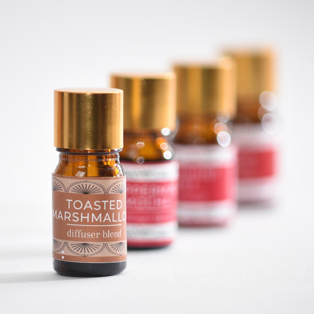 Row of diffuser blends with 'Toasted Marshmallow' label on a light background